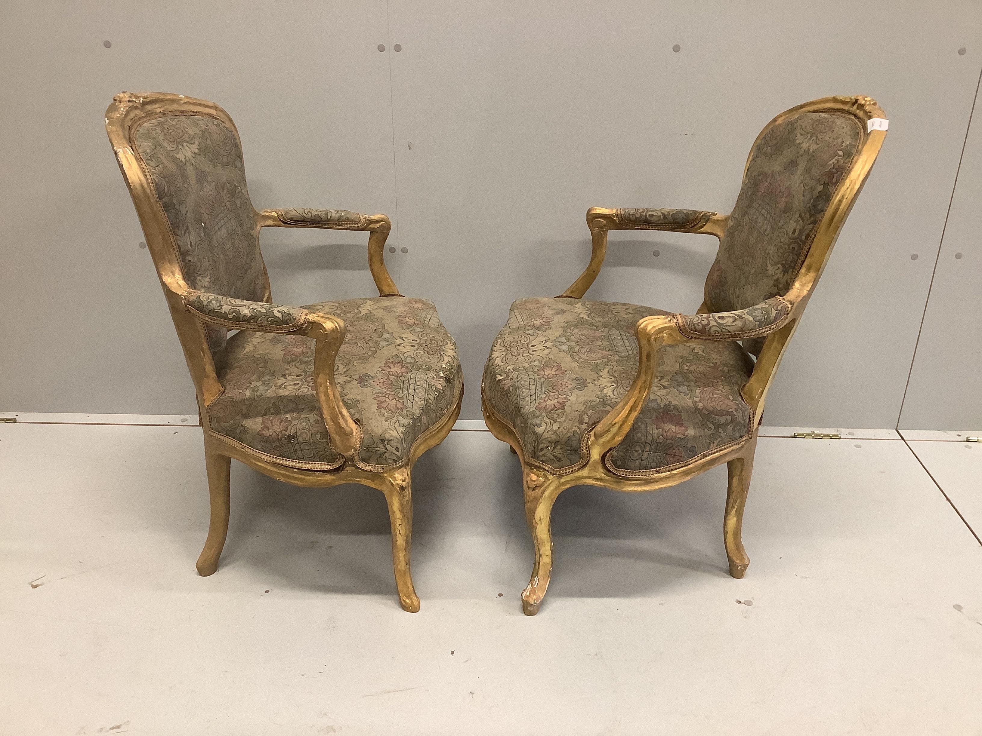 A pair of Louis XVI style giltwood and composition fauteuils, width 61cm, depth 52cm, height 86cm
